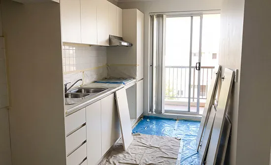 Refreshed kitchen cabinet doors with a sleek new finish from interior house painting in Brisbane