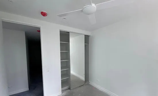 Calm, soft-toned bedroom walls after an interior house painting makeover in Brisbane