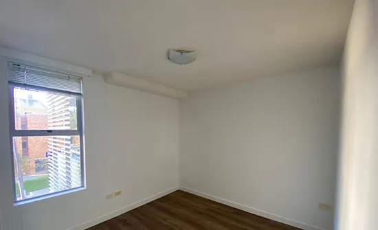 Smooth, even wall finish completed during interior house painting in a Brisbane home
