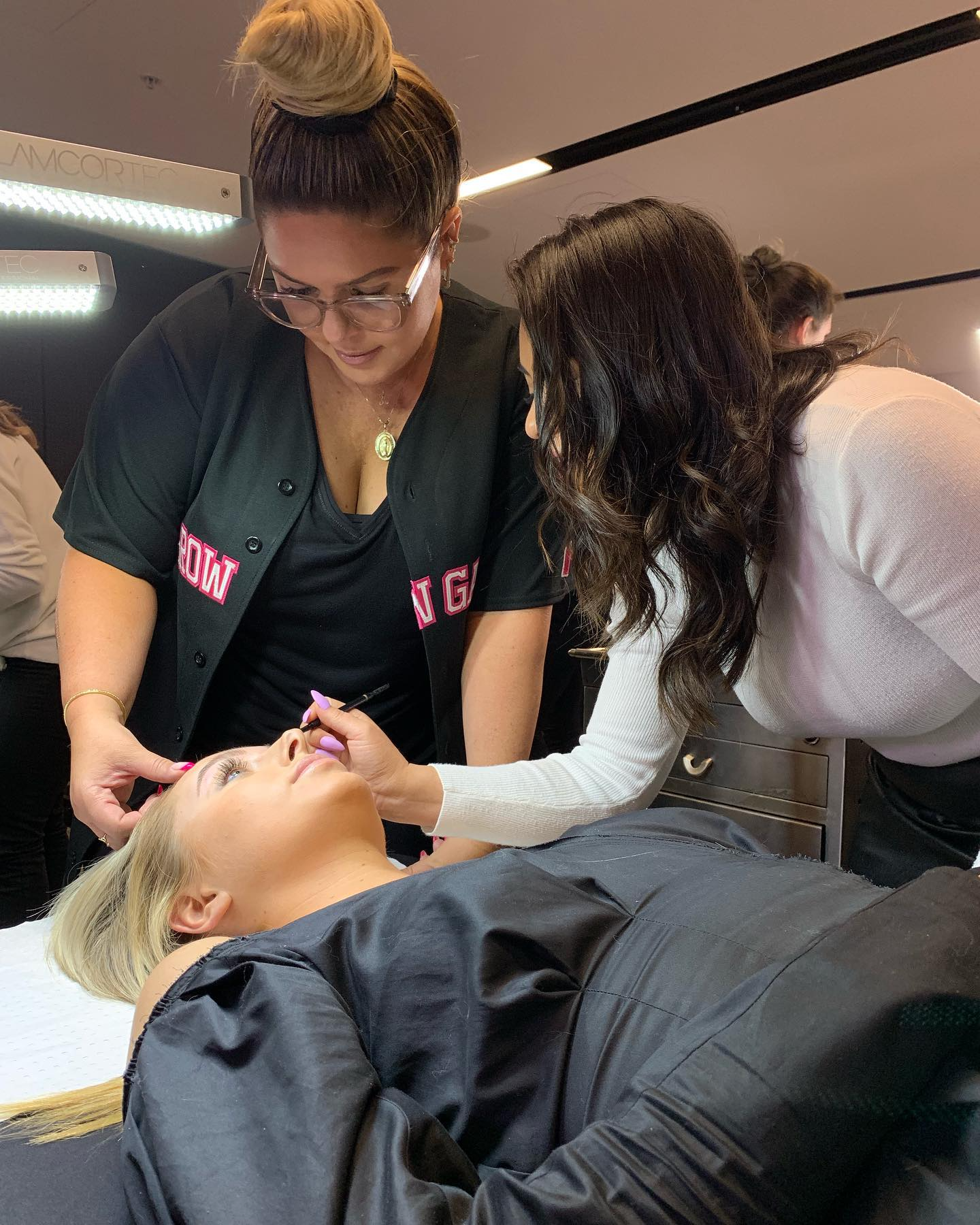 A senior skin therapist guiding a personalised pro-aging skin consultation at Elysian Cartel