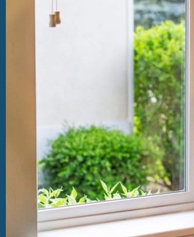 M&M Window Washing after window cleaning showing clear streak-free glass with bright outdoor view