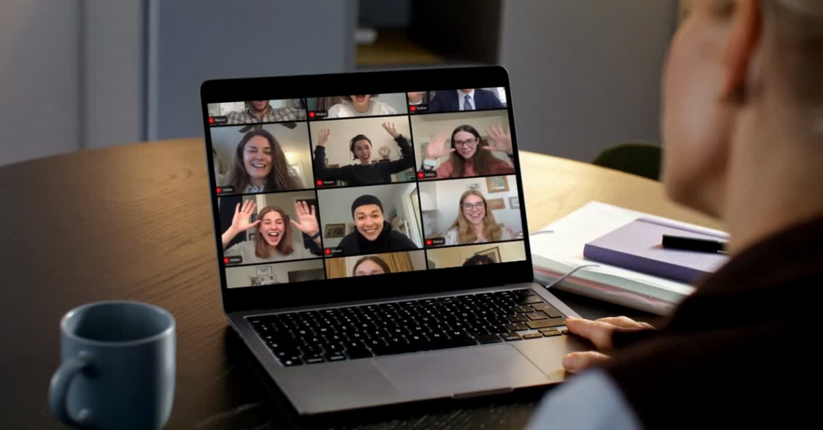 Online community members celebrating a business win on a group video call, representing peer support and entrepreneurship community