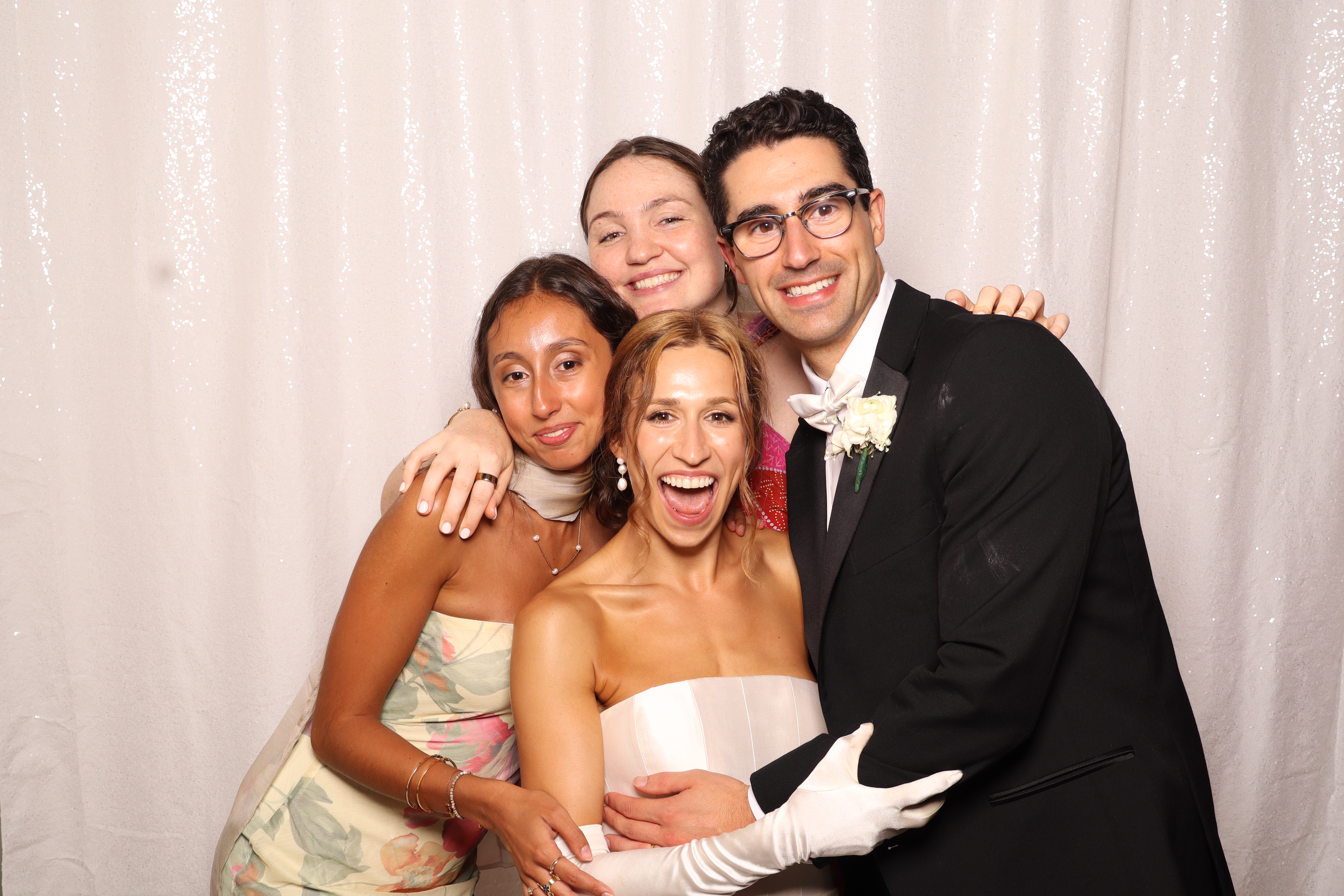 Wedding guests laughing at photobooth
