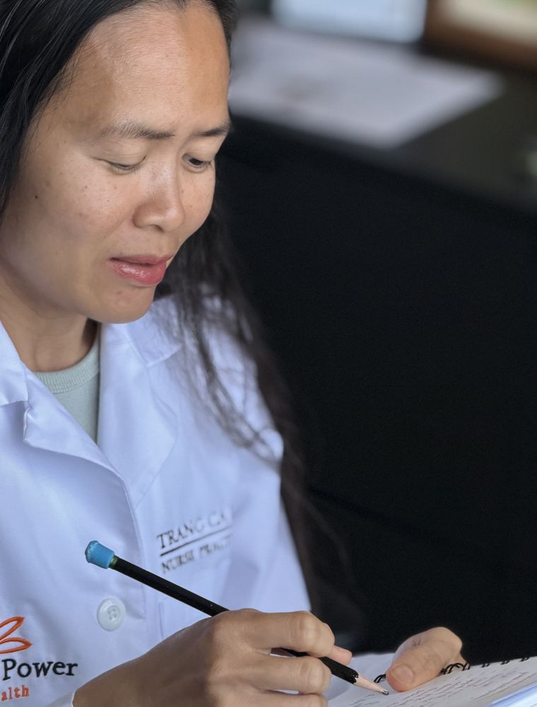 Trang writing out a plan by hand