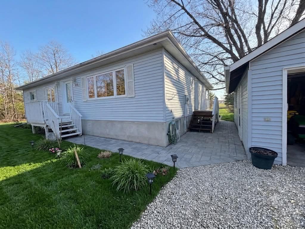 Finished landscaping with sod, gardens and planting