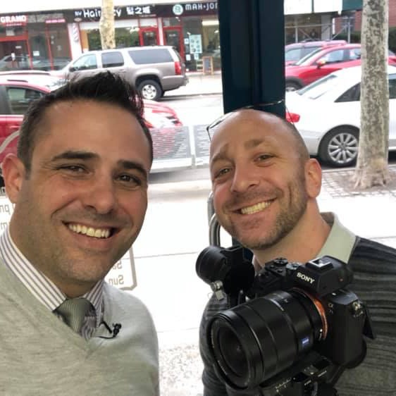 Chris Abazis and Jon Manzi smiling on a shoot day