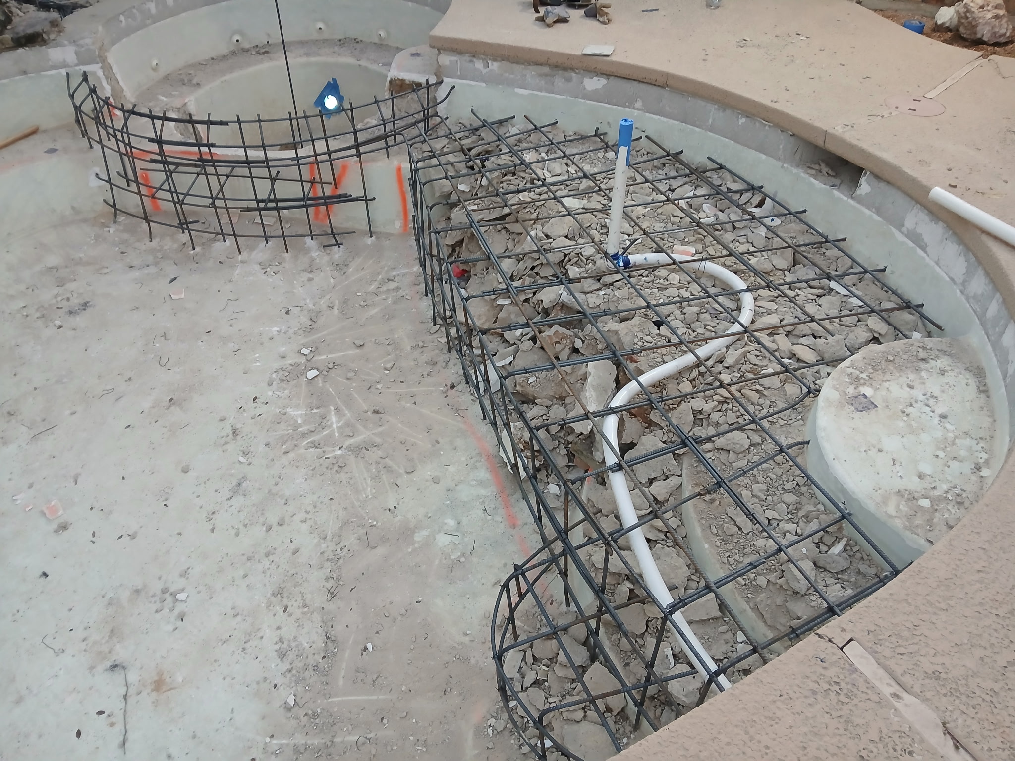 New pool installation in Haslet, TX backyard with freshly built pool shell