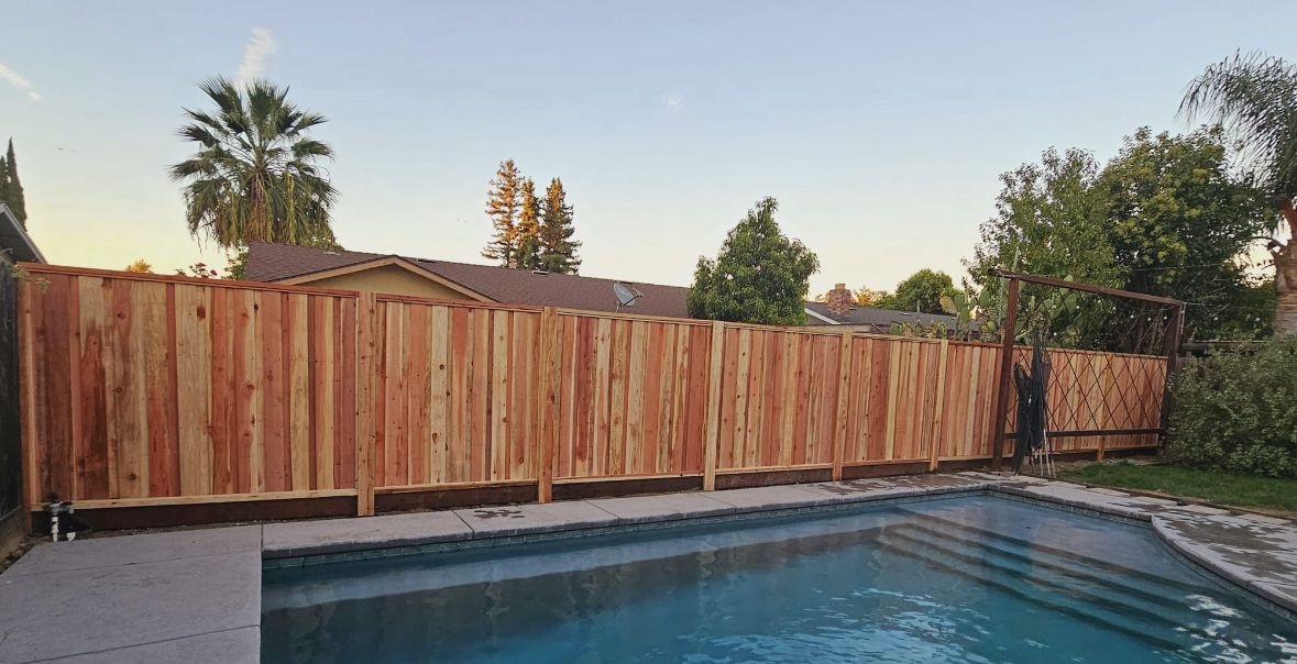 Metal posts used with a redwood fence for stronger support