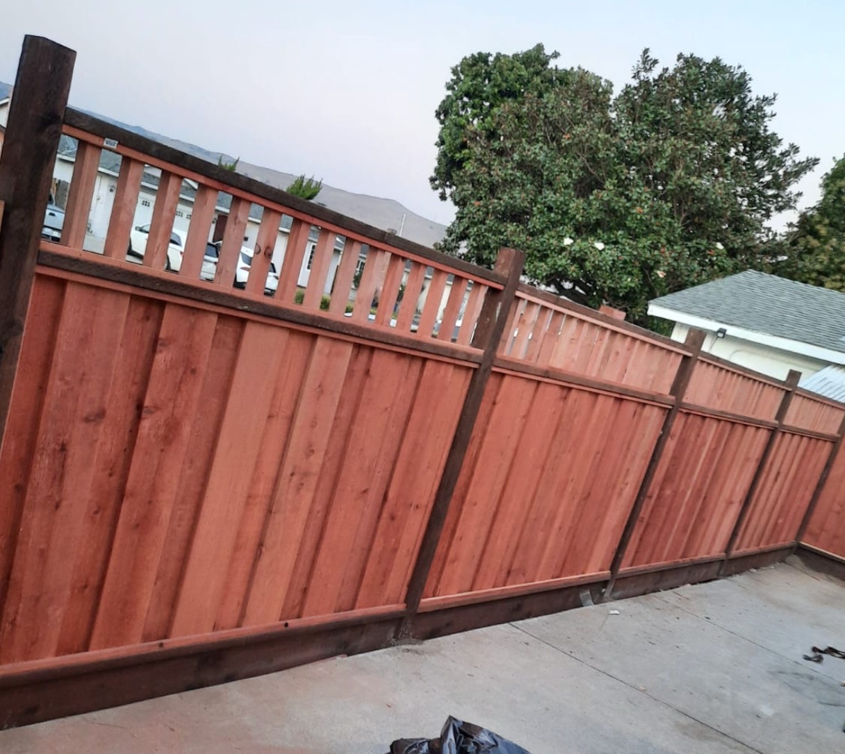 Board on board redwood fence installation by Hermanos Fence in the Bay Area