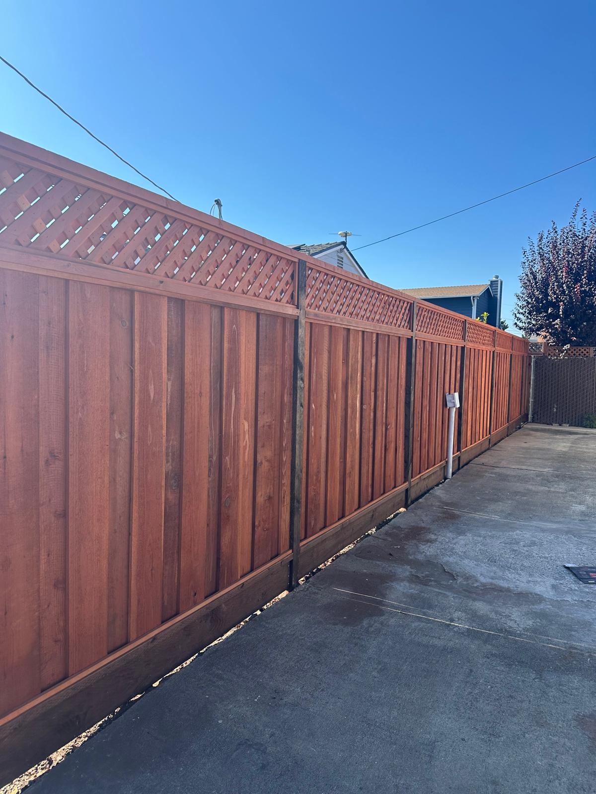 Backyard privacy fence installed by Hermanos Fence
