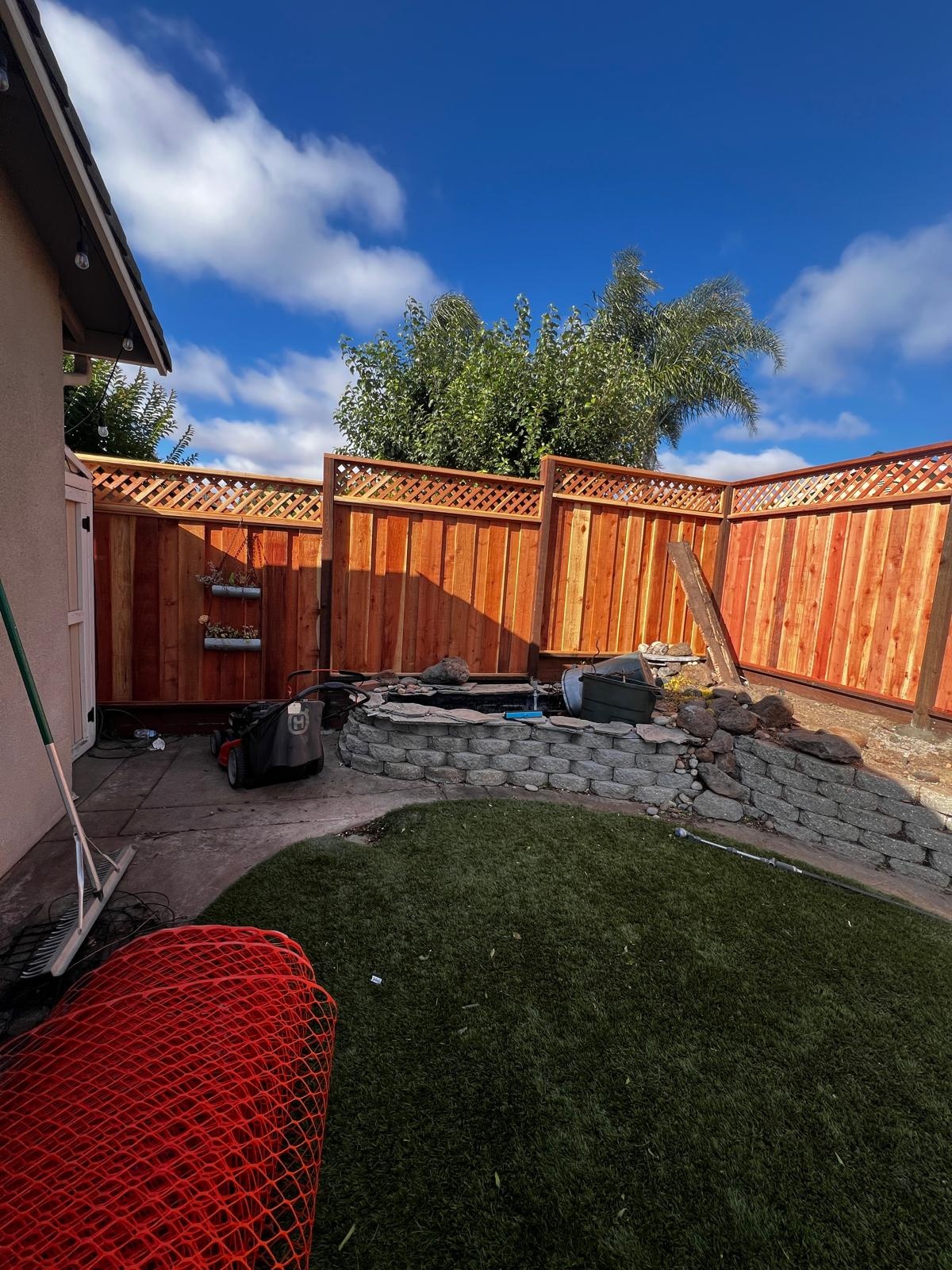 Board-on-board redwood fence installation in San Ramon CA
