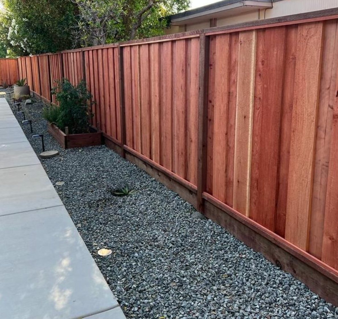 Redwood fence installed by Hermanos Fence