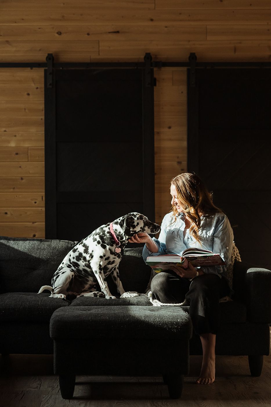 Megan on the sofa with her Dalmatian, Emma