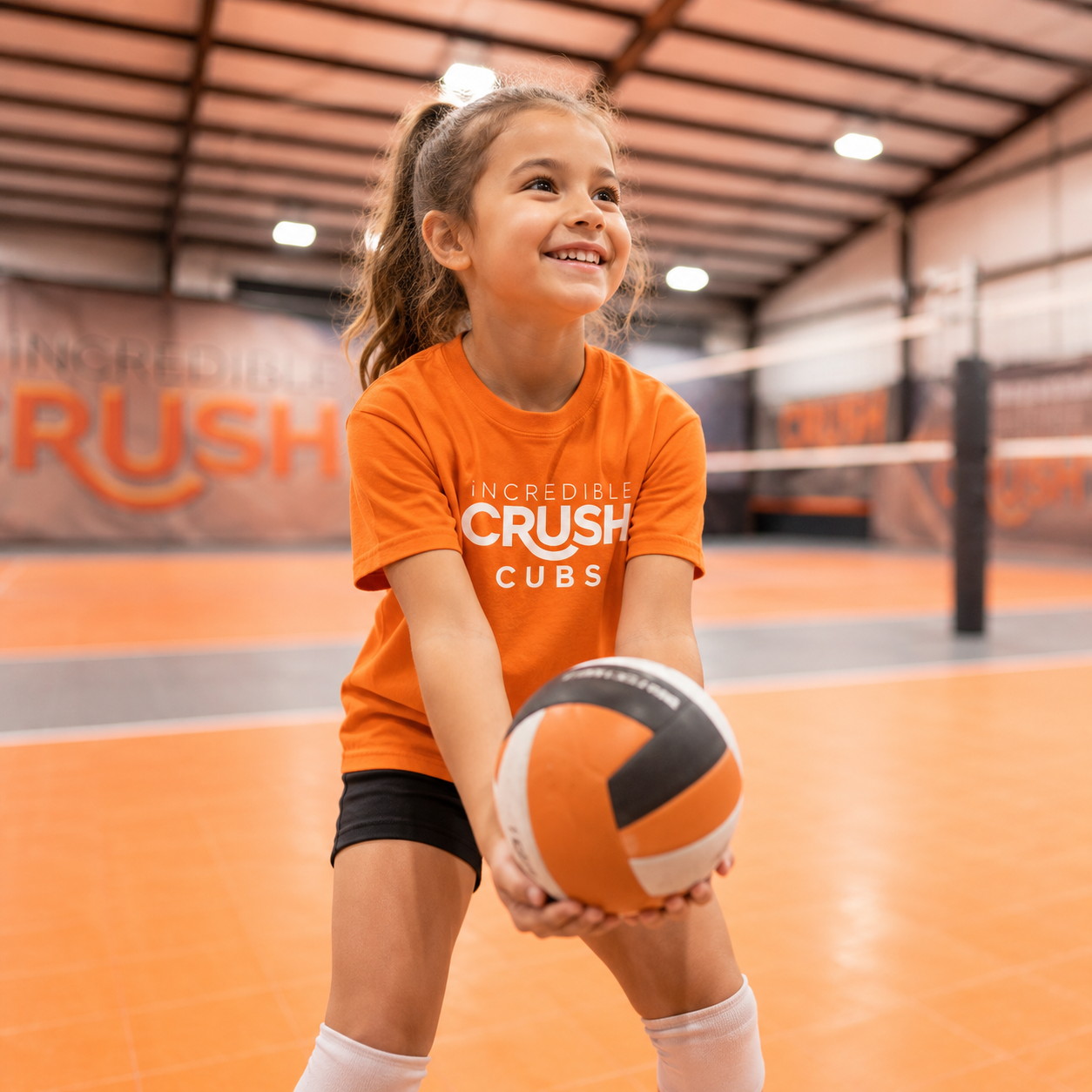 Young player holding volleyball