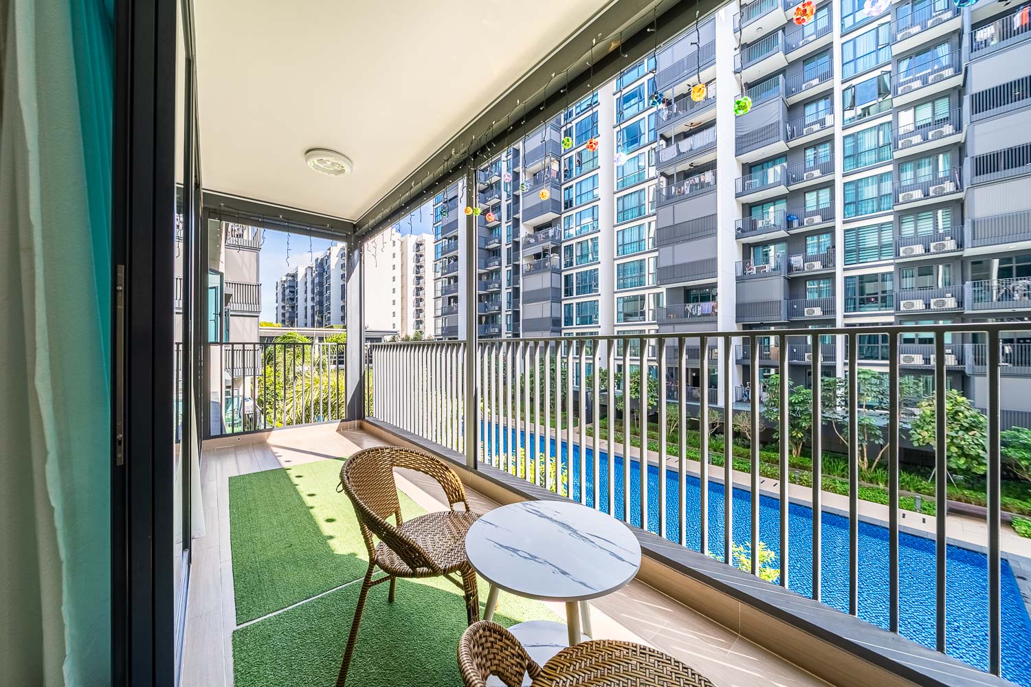 modern residential balcony overlooking pool real estate photography