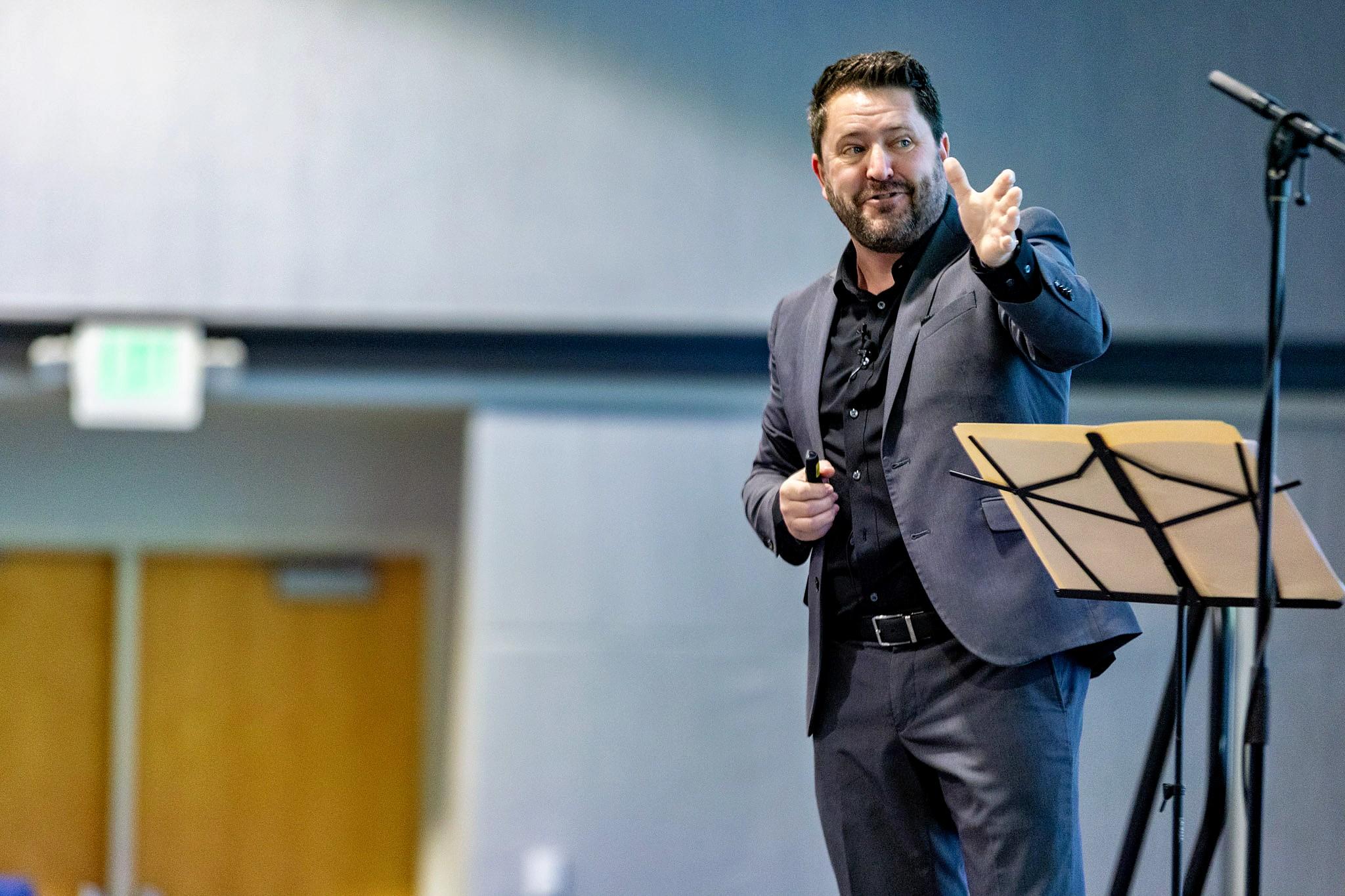Wayne, founder and coach at Hero Nation, speaking on stage