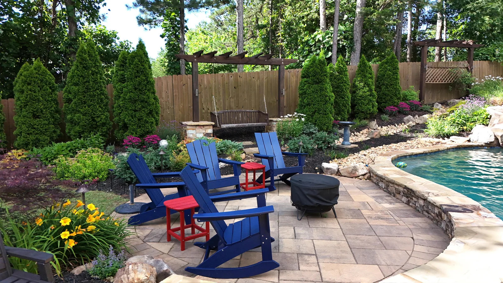 Poolside patio seating and landscape design