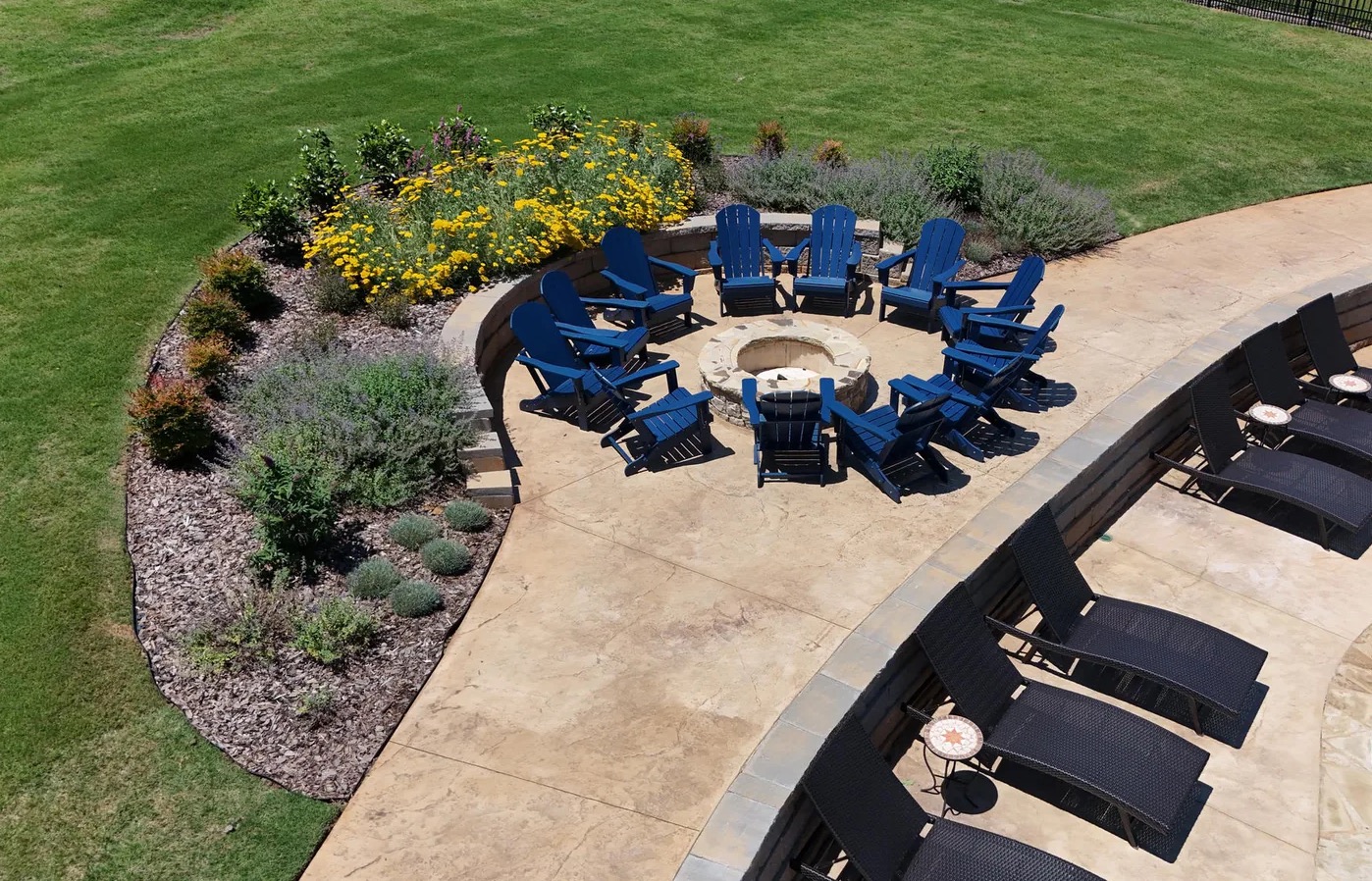 Fire pit patio with custom seating wall