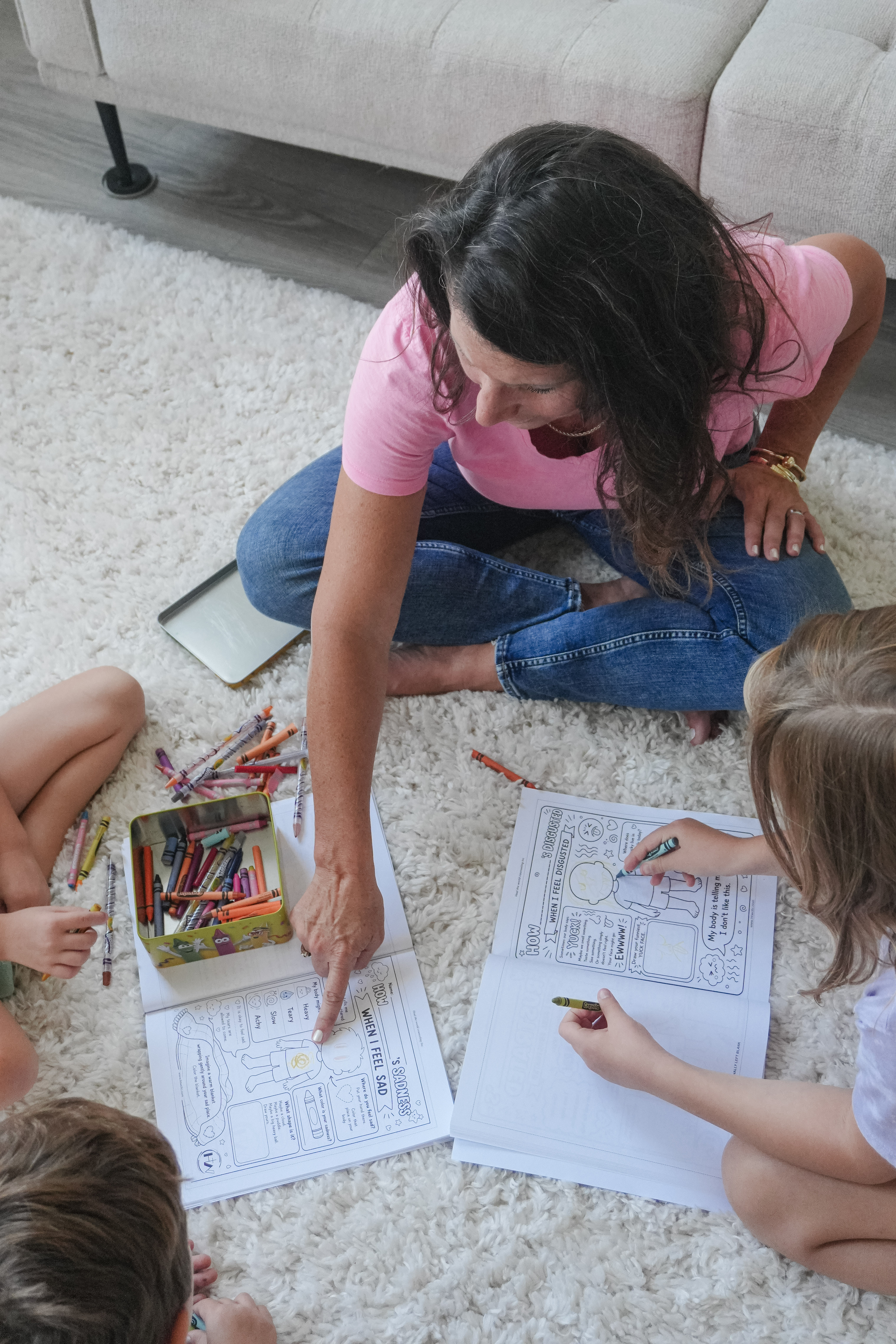 Sarah Eva sitting with children