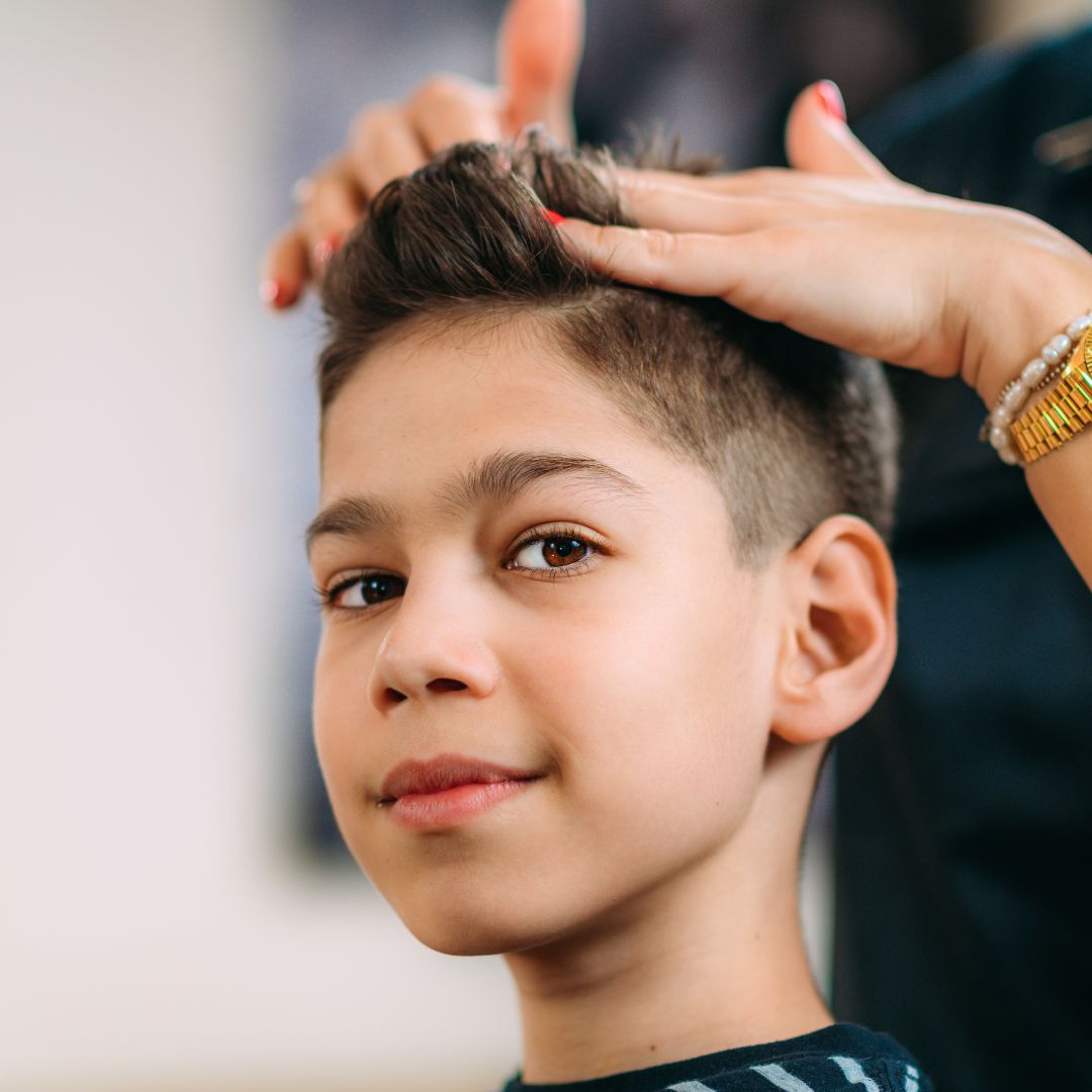 Young boy getting a fresh haircut at Salon Salman in Pierrefonds, Montreal