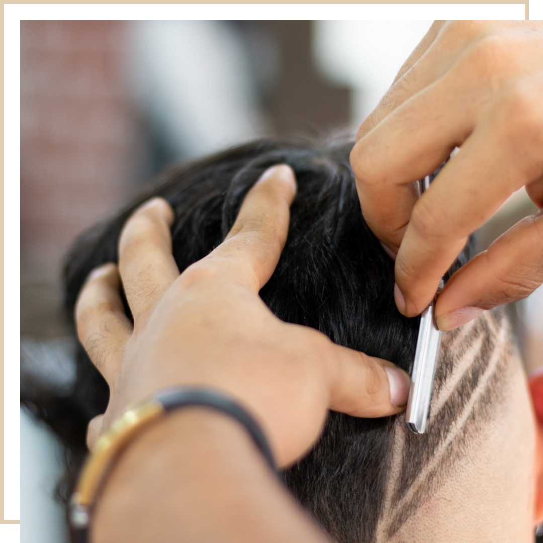 Barber giving a precision haircut at Salon Salman barbershop in Pierrefonds, Montreal
