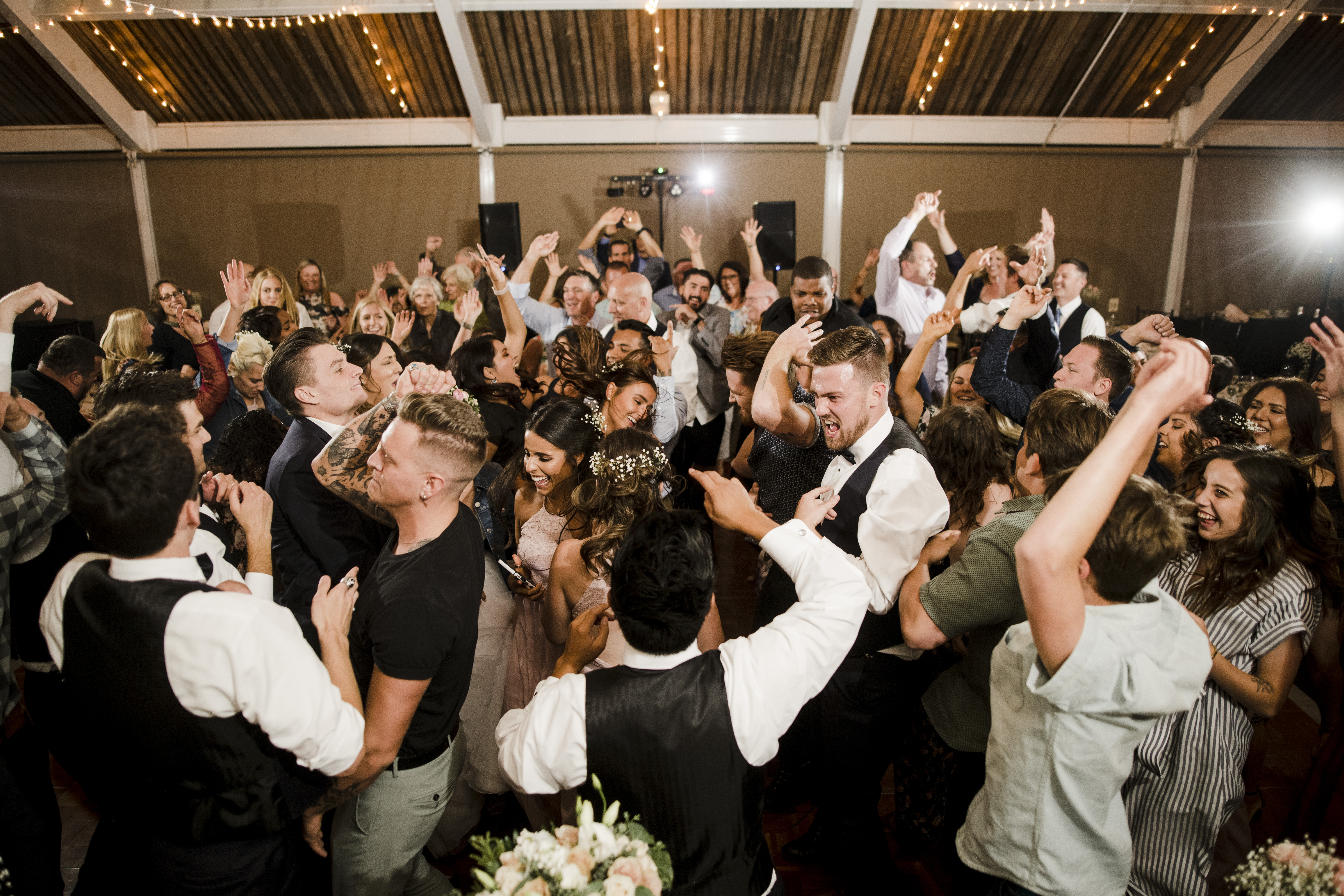 A packed dance floor at a GTE Event Group wedding reception