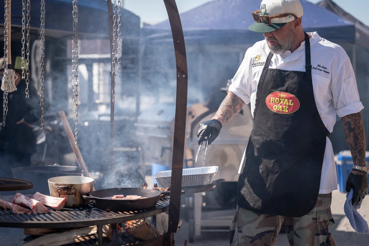 Chef grilling over live fire