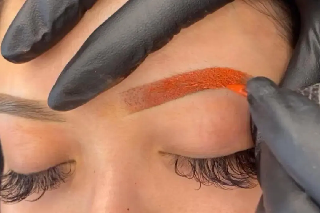 Before-and-after showing permanent makeup color correction on eyebrows