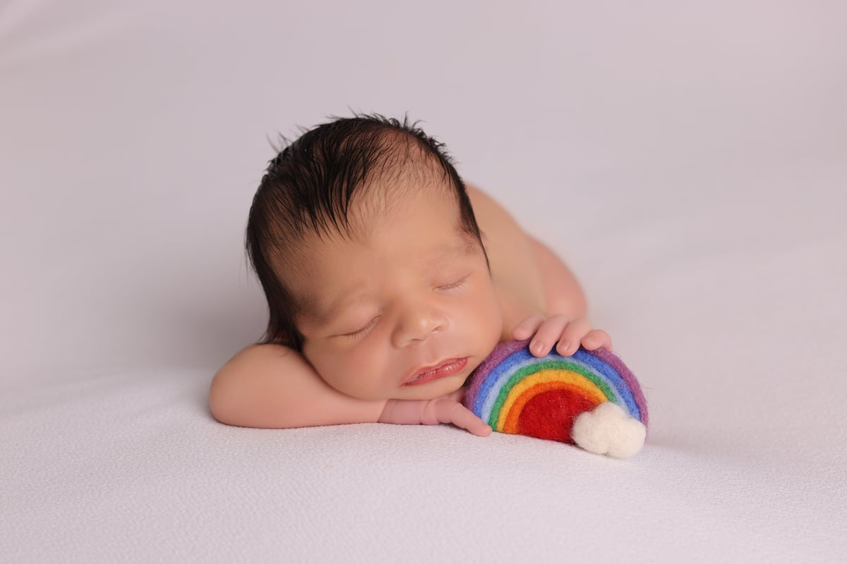 Photo of baby sleeping on its front , taken by Ipswich baby photographer