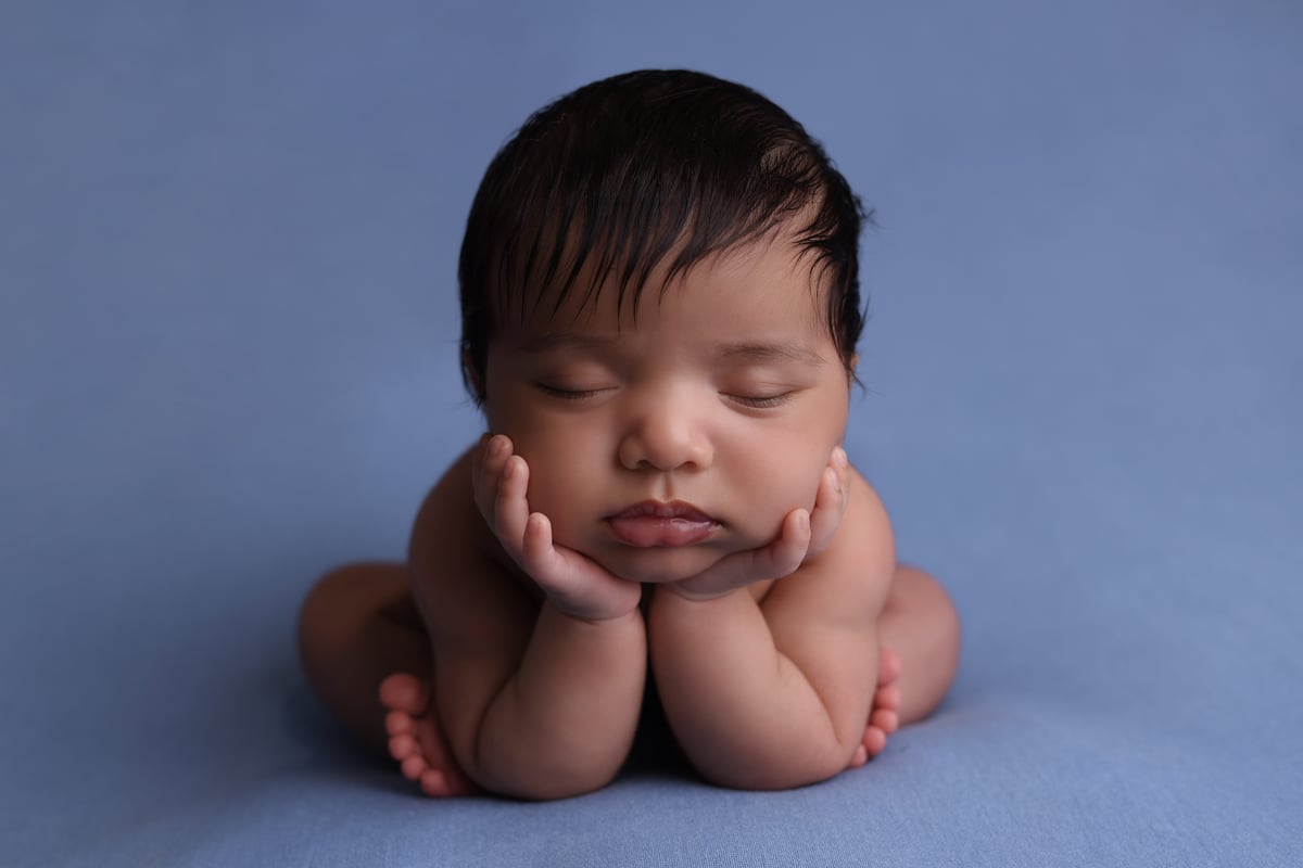 Photo of baby sleeping on its front , taken by Ipswich baby photographer