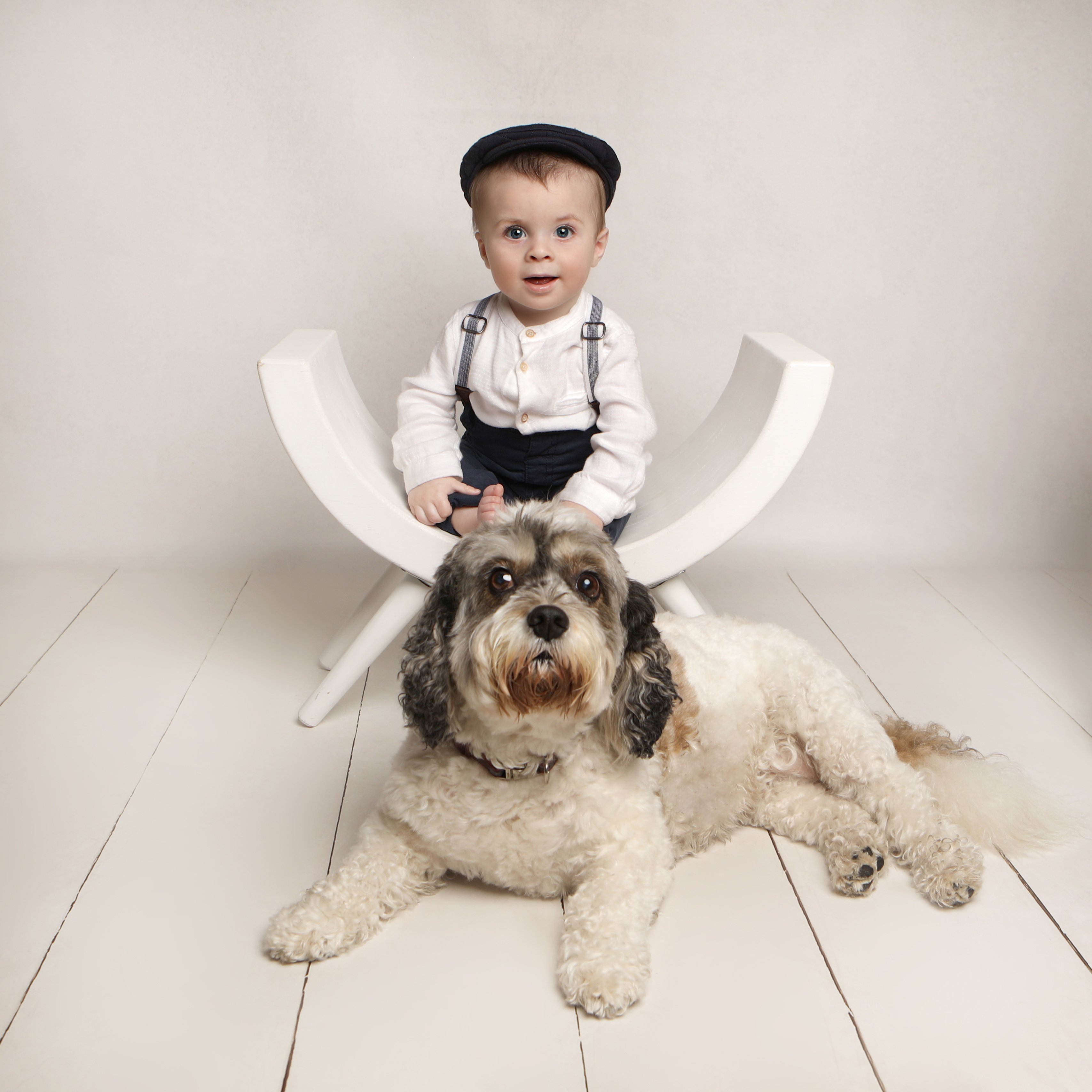 Young child with dog - Professional baby photos taken by baby art Manchester