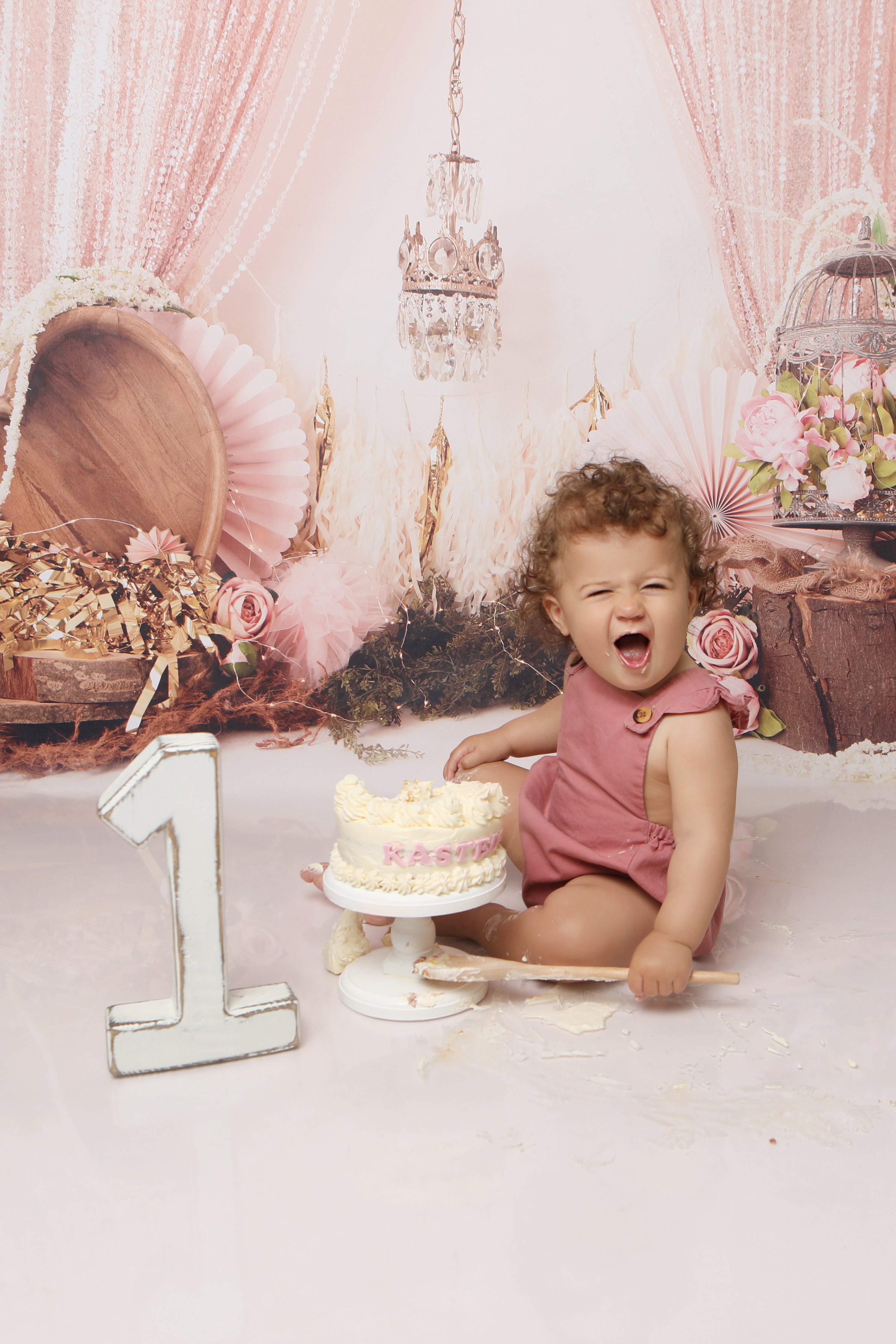 1 Year Old sitting with cake - Professional baby photos taken by baby art Manchester