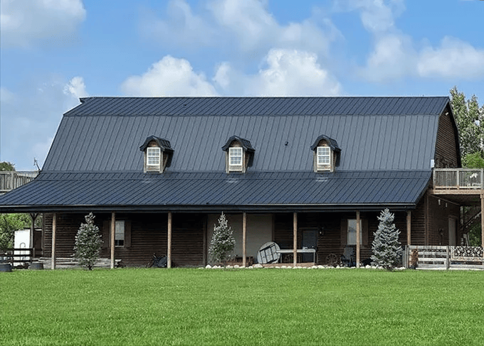 A roofing professional inspecting a home's roof