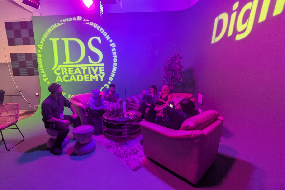 Creative professionals and students collaborating during a networking event focused on arts, innovation, and career opportunities.