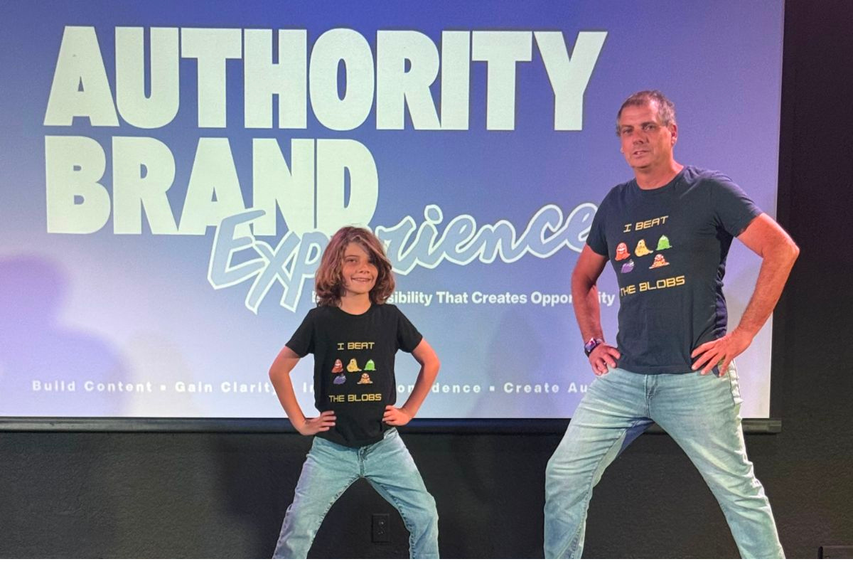 Speaker confidently presenting on stage, inspiring an audience through storytelling, creativity, and leadership, representing the mission of JDS Studio and Spirit of Innovation: Arts Across America.
