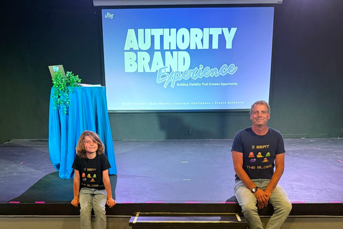 Speaker confidently presenting on stage, inspiring an audience through storytelling, creativity, and leadership, representing the mission of JDS Studio and Spirit of Innovation: Arts Across America.