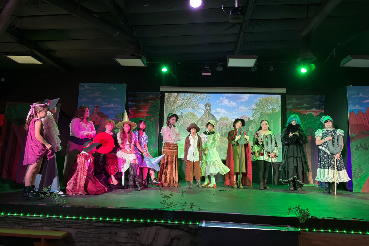 A diverse group of students collaborating on a creative arts project, expressing themselves through visual and performing arts in an inclusive learning environment.