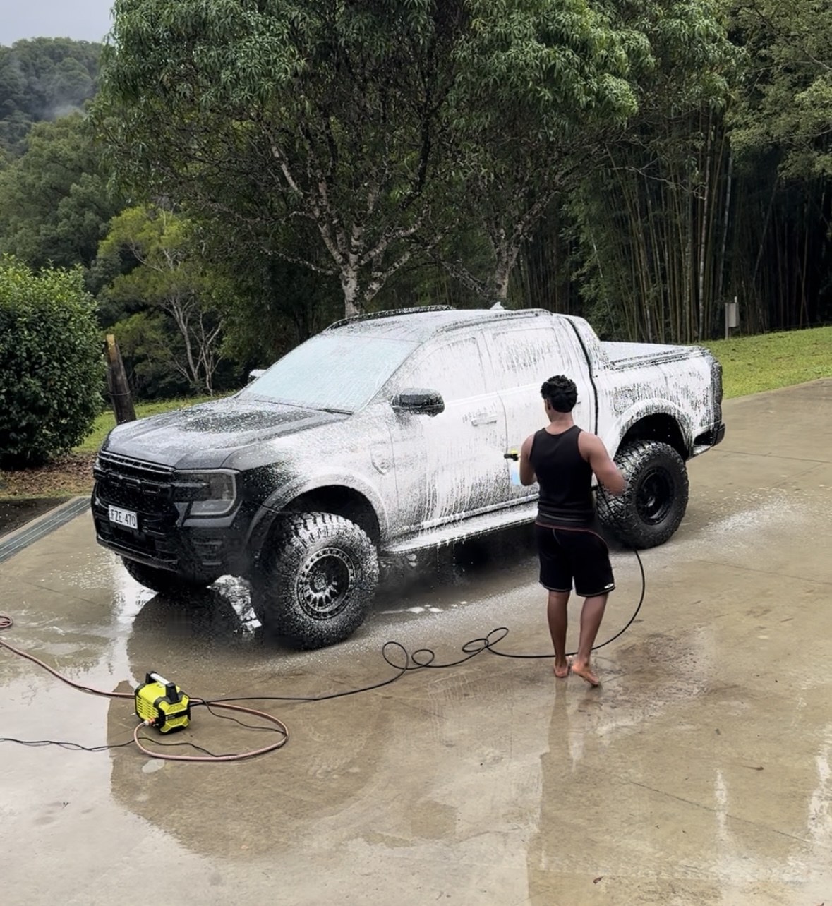 SVR Autostyle applying snow foam to a ute on a driveway