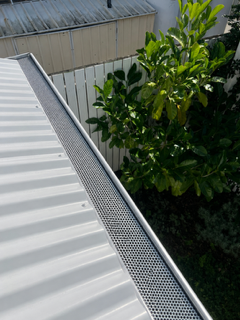 The same gutter with gutter guard fitted along the run by First Choice Gutter Services
