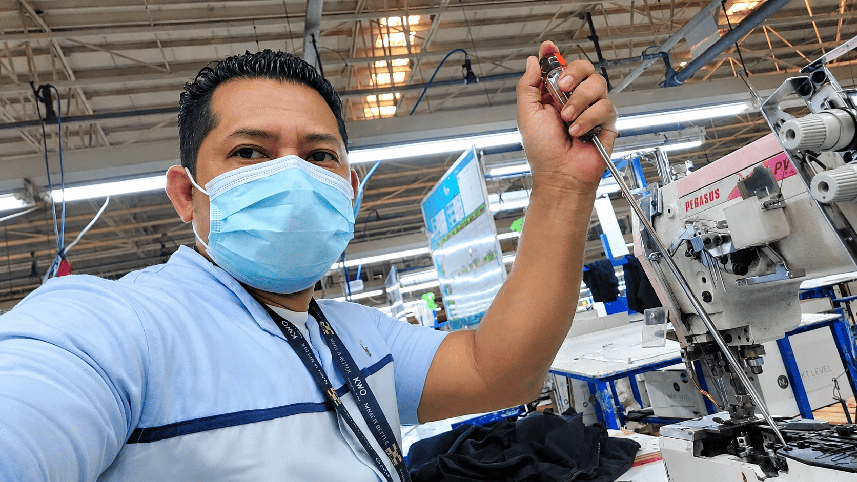 Meneces technician at an industrial sewing machine