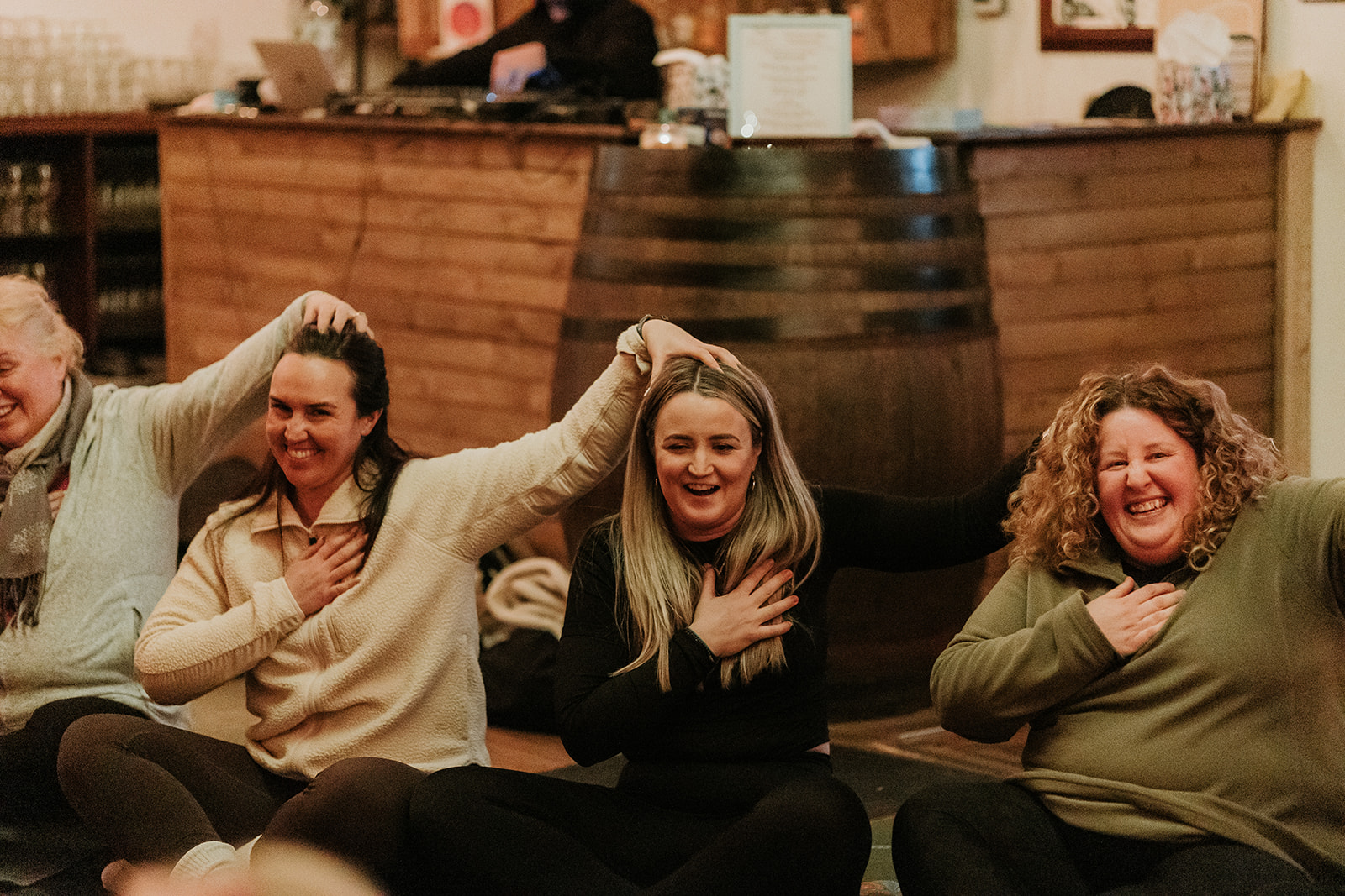 A team sharing a moment in a workplace wellbeing session in Glasgow with Elliott Wellbeing.
