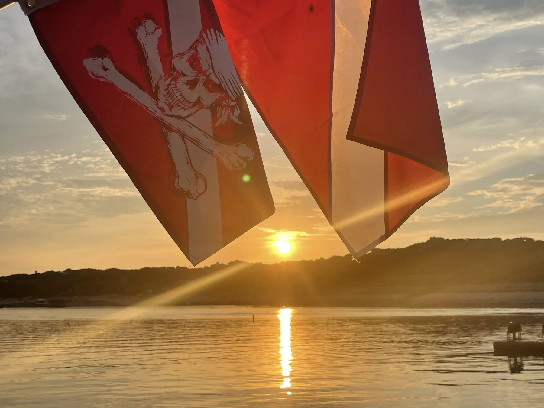 Dive flags at sunset on Lake Travis
