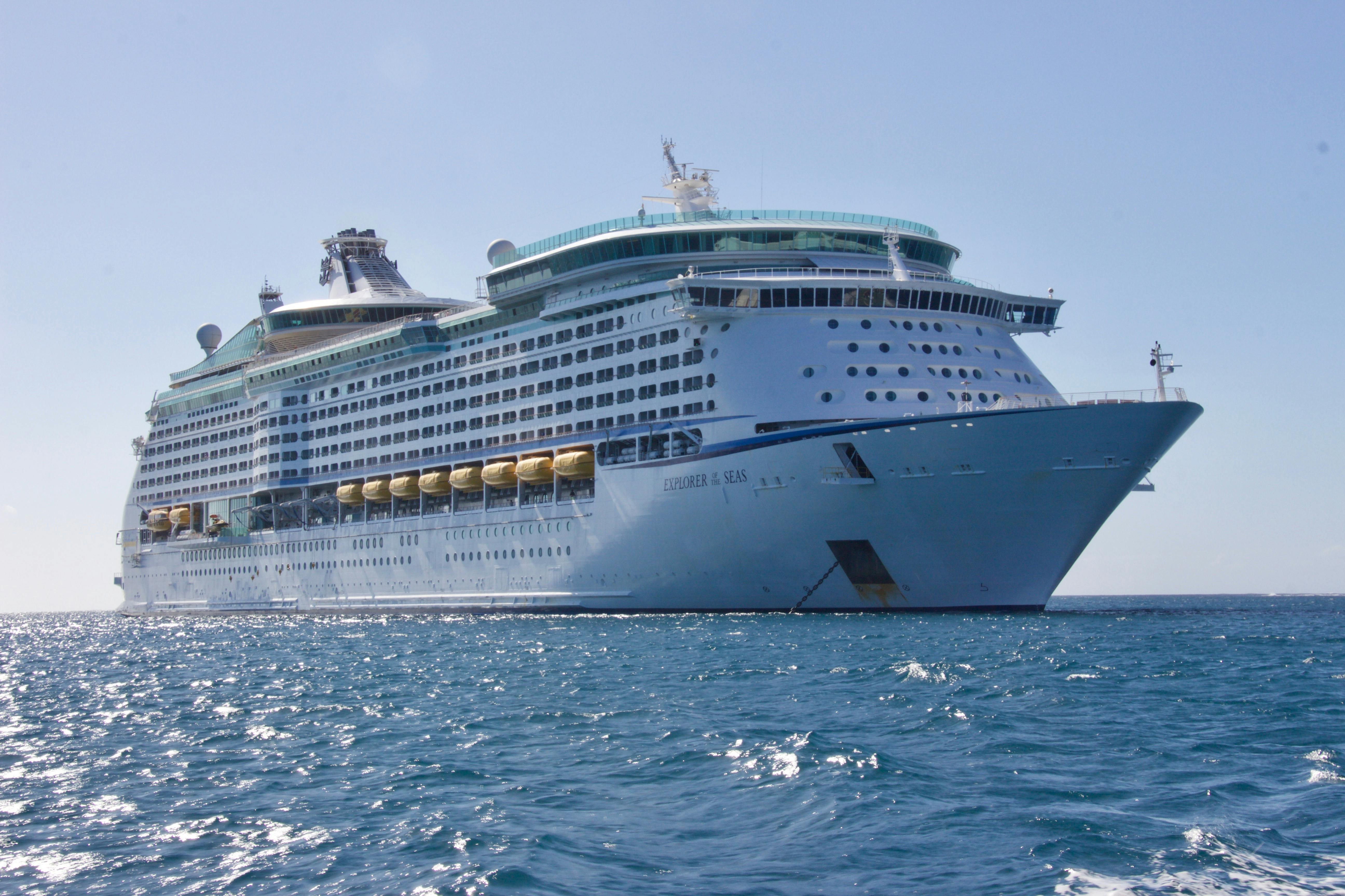 Cruise ship on open water at sunset