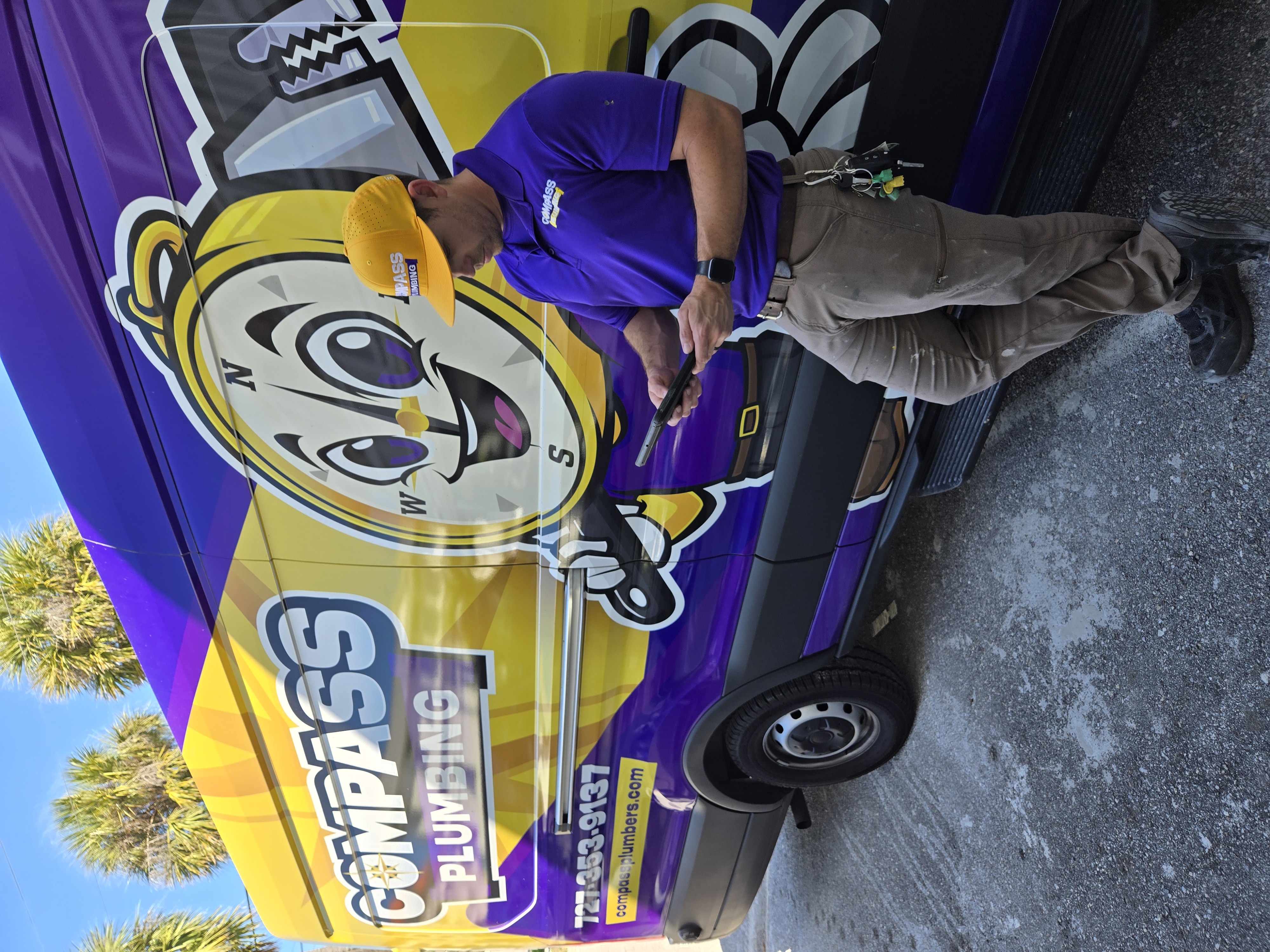 Compass Plumbing technician and service van in New Port Richey
