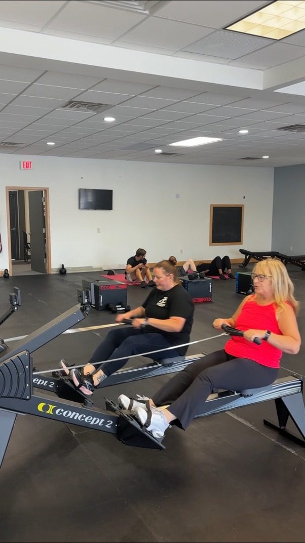 Portion Fitness members training together on the gym floor