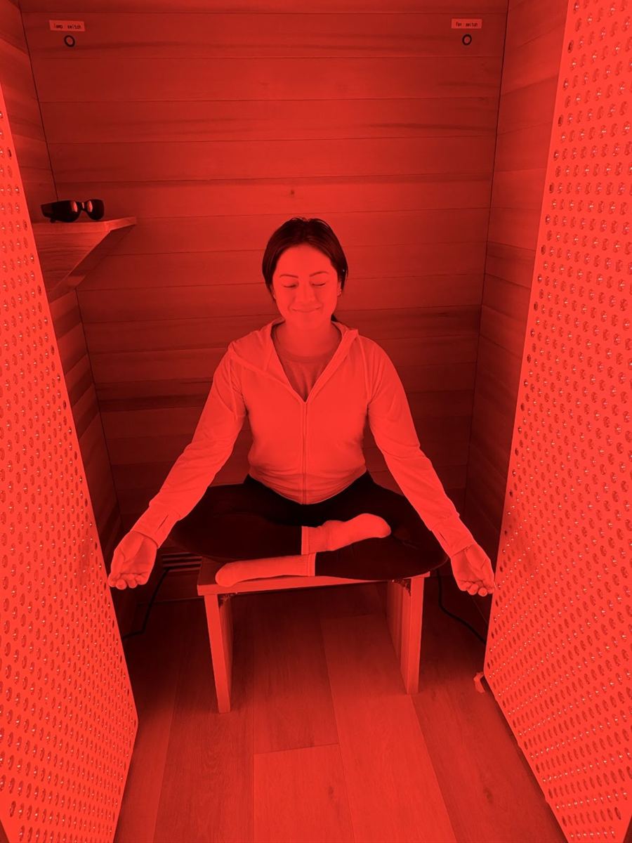 A member meditating in the red light therapy suite