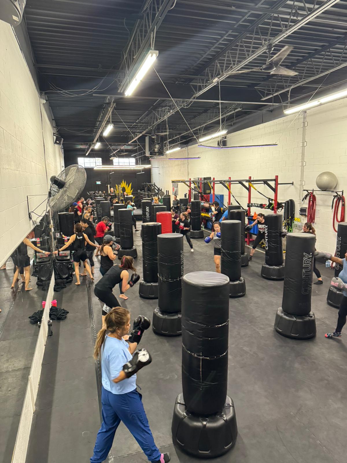 High-energy group workout at Fight Fitness during a charity event supporting Jays Care Foundation, with members training together in honour of Stephen Osbourne