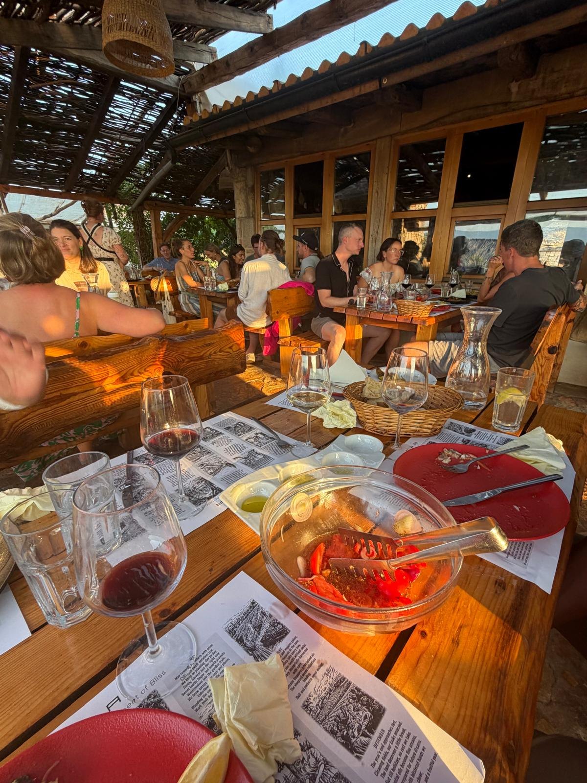 Parents at long wooden tables at the welcome dinner, first night