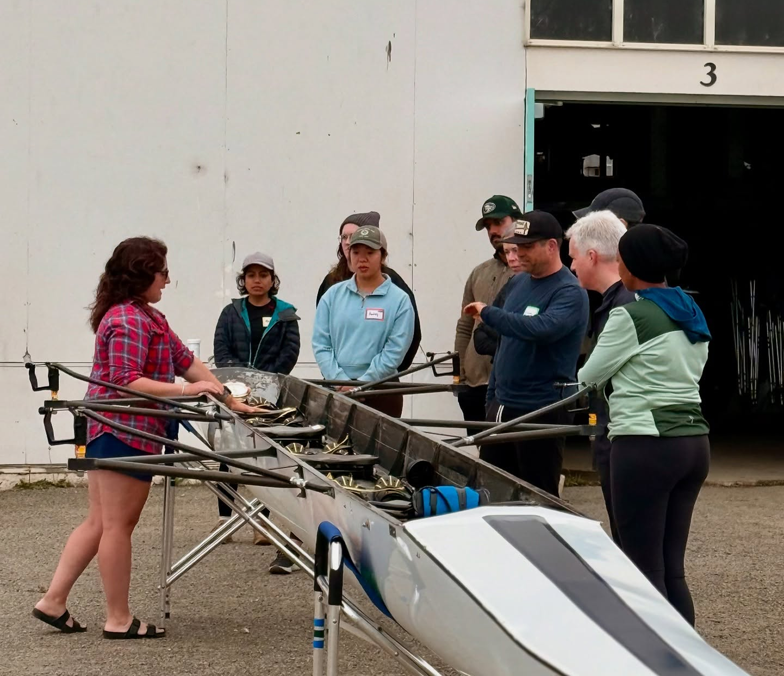 Coach explaining the boat to new rowers