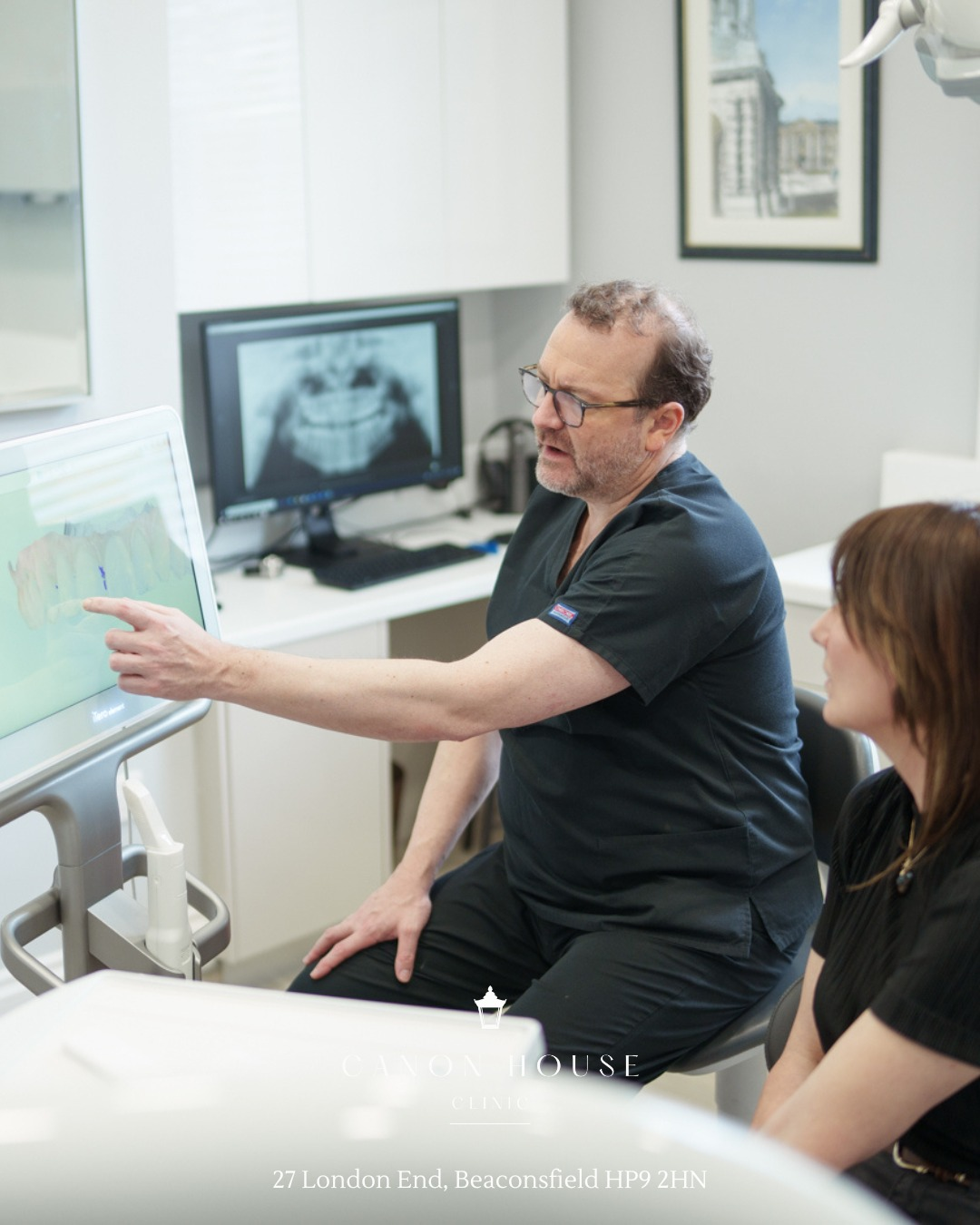 Mark Hughes reviewing a dental scan at Canon House Clinic